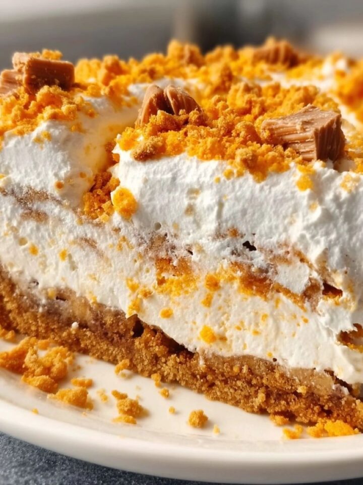 Butterfinger pie with creamy filling and crushed candy topping