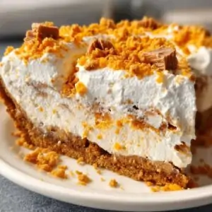 Butterfinger pie with creamy filling and crushed candy topping