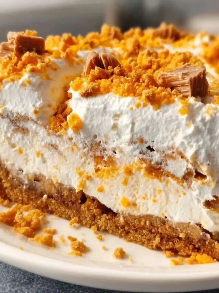 Butterfinger pie with creamy filling and crushed candy topping