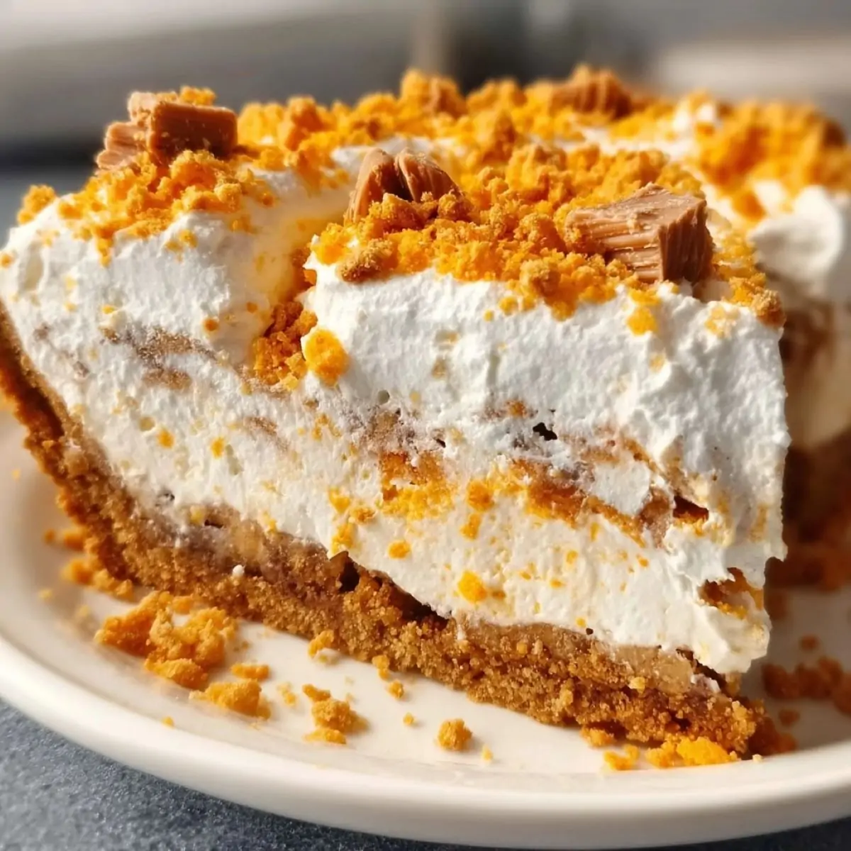 Butterfinger pie with creamy filling and crushed candy topping